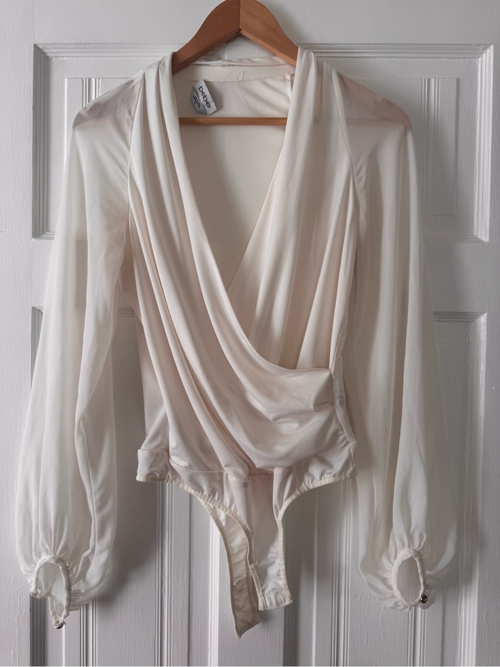 bebe Cream Drape-Front Long Sleeve Bodysuit, size S